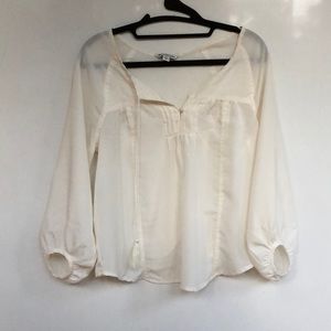 Cream shirt with scoop back
